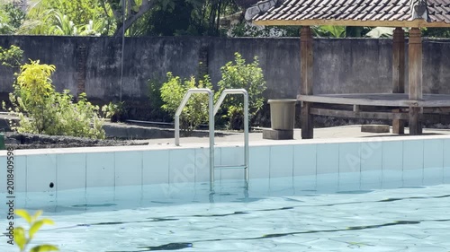 Clear Blue Swimming Pool with Traditional Gazebo in Tropical Resort Setting