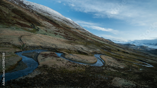 Tibetan Temple by River with Snow Mountains in Tibet, Sacred Himalayan Landscape