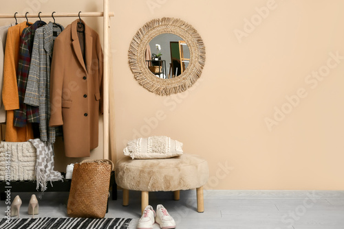 Rack with stylish clothes, ...
