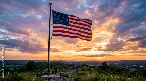 American flag waving at sunset over rolling hills and distant city