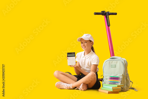 Cute schoolgirl with electr...