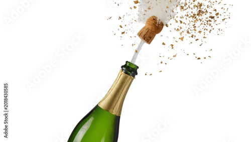 Fotografie Green glass Champagne bottle with gold foil popping cork and spray