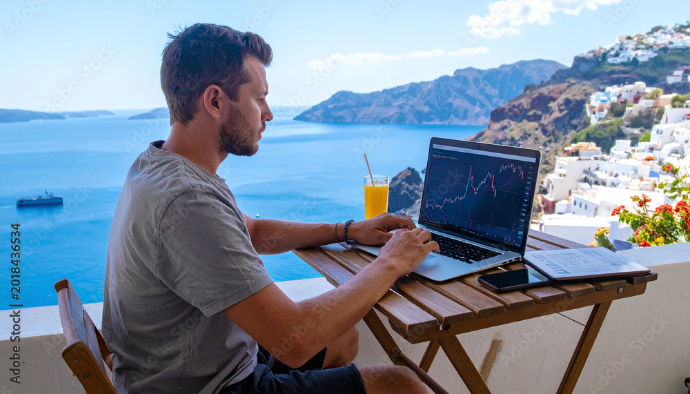 Fototapeta premium A young entrepreneur manages investments from a Santorini terrace. Capturing the digital nomad lifestyle, this highquality photo signifies financial independence and remote success.