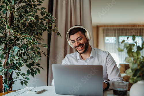 Man smiling working from home on video call