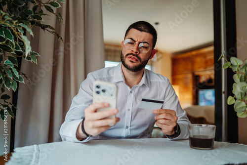 Man experiencing credit card fraud while online banking