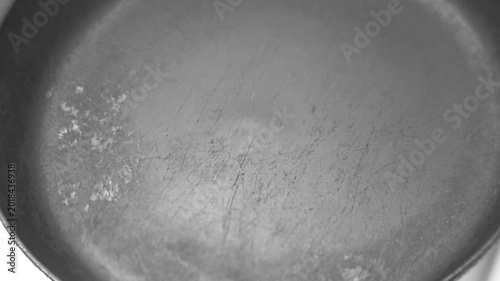 Place the frying pan on a hot electric stove
