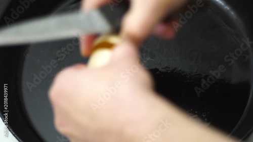 making fried eggs for breakfast