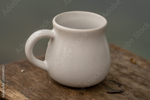 White Ceramic Mug on Rustic Wooden Table Minimal Cozy Coffee Cup Close Up