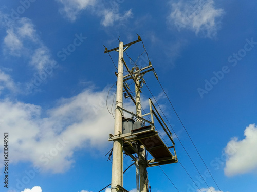 Tapety artystyczne An electrical power transformer mounted on a utility pole.