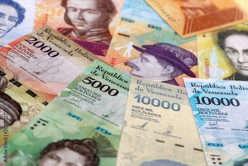 Fotografía Venezuelan bolivar money bills pile on table
