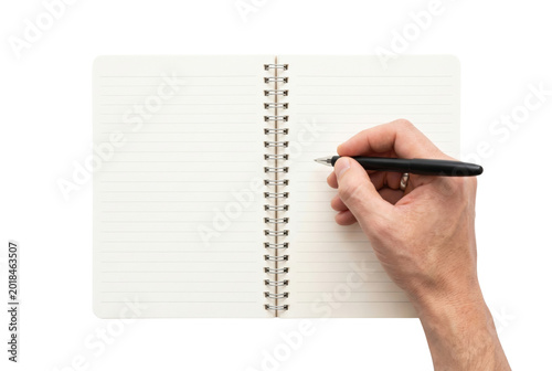 Foto Spiral notebook with pen in hand top view isolated