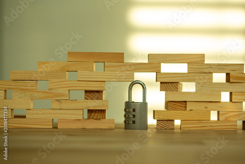 A padlock in front of a wal...