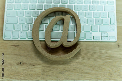 Email symbol resting on a c...