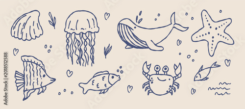 Hand-drawn sea life doodle set with whale, jellyfish, crab and fish.