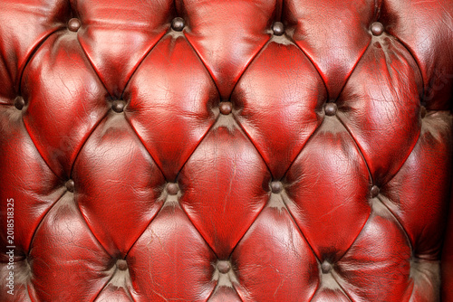 Rich red tufted leather tex...