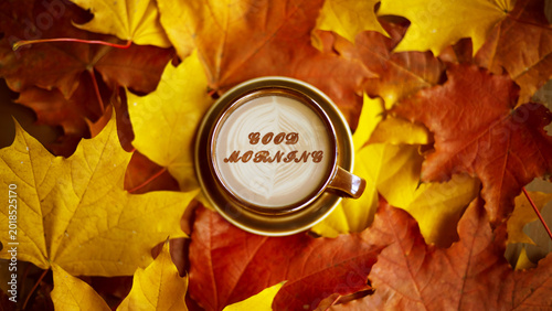 Foto Autumn leaves with a cup of coffee on a wooden surface, cozy seasonal mood, fall relaxation, warm lifestyle, Thanksgiving