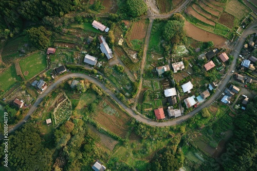 Aerial View of a Rural Japanese Village with Terraced Fields