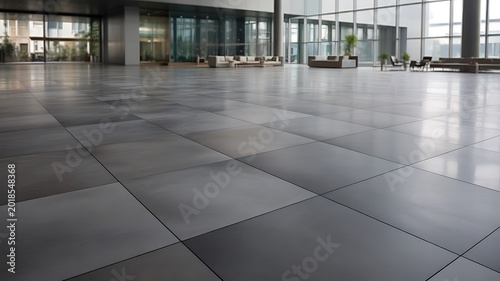 Modern spacious office building lobby with tile flooring