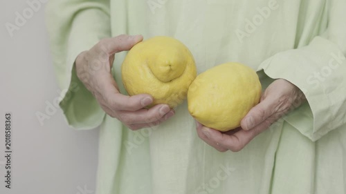 Woman with lemon fruit