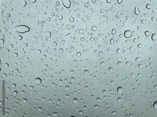 Water drop on glass or windshield rain.