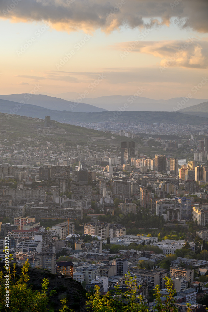 Fototapeta premium Panoramic aerial cityscape sunset view of Tbilisi, the capital of Georgia