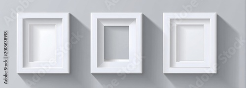 Three white shadow boxes with different depths and openings on a gray background.