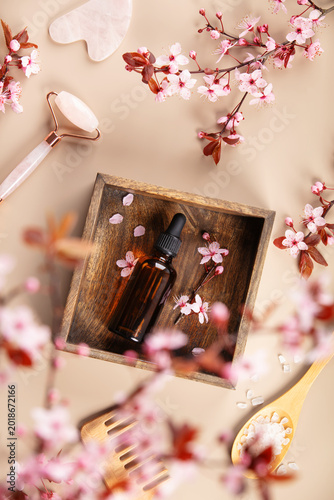 Natural Skincare Flat Lay with Essential Oil and Cherry Blossoms