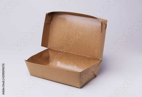 Open empty brown kraft paper takeaway food box isolated on white background