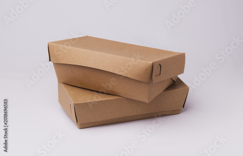 Closed eco-friendly brown paper lunch box isolated on white