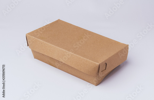 Closed eco-friendly brown paper lunch box isolated on white