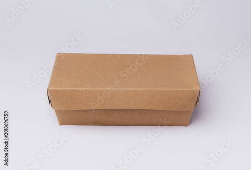 Closed eco-friendly brown paper lunch box isolated on white