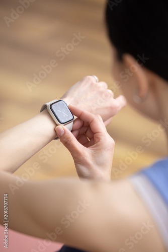 Close Up of Smartwatch on Woman's Wrist Wearing Yoga Wear