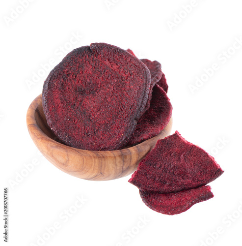 Crispy roasted beetroot chips with sea salt, isolated on white background. Healthy and crunchy natural vegetable snack. Clipping path.