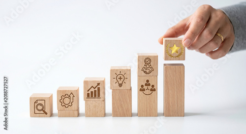 Konstfotografi Goal achievement concept with hand placing target wooden block on checkmark pyra