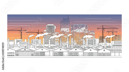 Industrial city landscape with factory buildings and construction cranes.