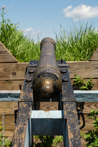 Revolutionary War cannon set within wooden defensive earthworks at Valley Forge on a clear spring day.