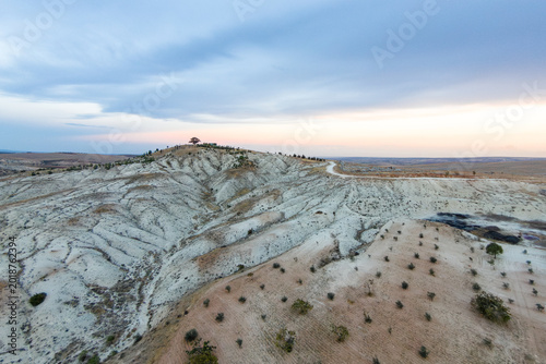 Photos Severe erosion formations across semi-arid badlands terrain with calcareous soil