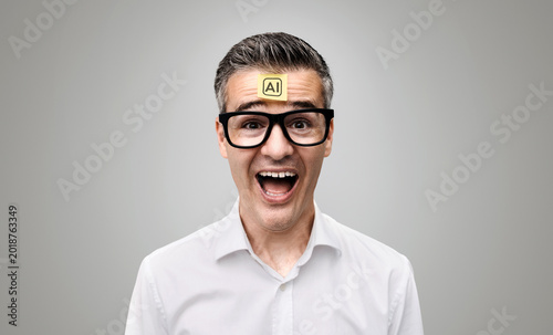 An enthusiastic man with a Post-it note on his forehead that says “AI.”