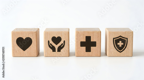 Wooden blocks with health care symbols on white surface