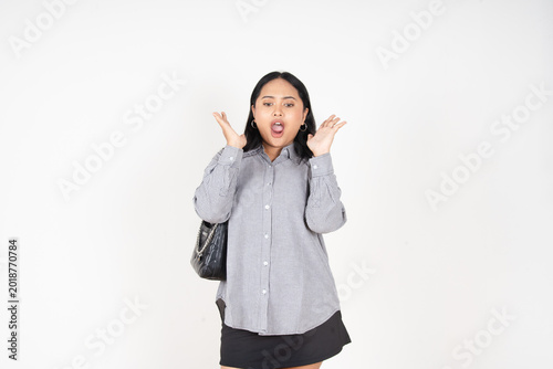 Obraz na plátně Woman holds head, eyes closed, face contorted in distress