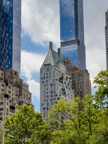 Hampshire House and Central Park Tower in New York City. Close up view of historic Hampshire House green roof and modern Central Park Tower skyscraper, Manhattan, USA.