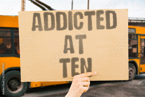 Billede på lærred "Addicted At Ten" Children become addicted to gambling-style game rewards before age twelve