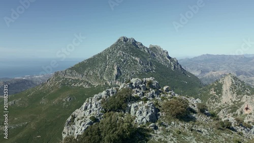 Majestic aerial view of Puig Campana (1.406 m) limestone mountain overlooking the mediterranean near Alicante, Costa Blanca - stock video