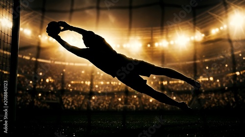 Silhouette of a soccer goalkeeper making a dramatic save in a stadium