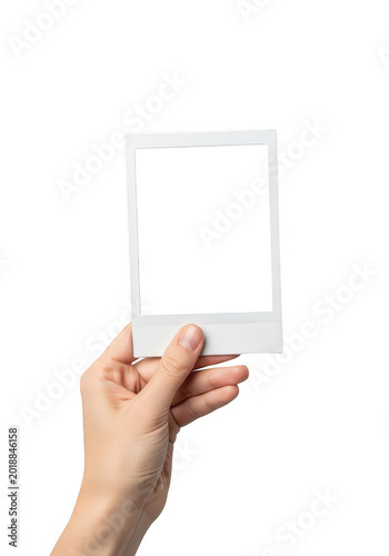 Hand holding a blank polaroid photo frame isolated on transparent background