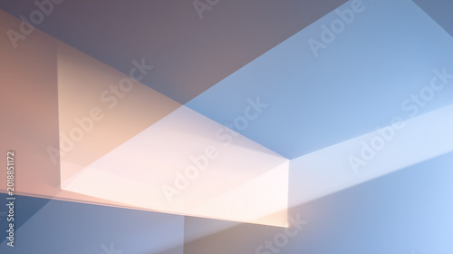 Abstract geometric forms blending light and shadow. The play of light and shadow creates a modern art feel. The clean lines and angles of the composition evoke a sense of calm and sophistication.
