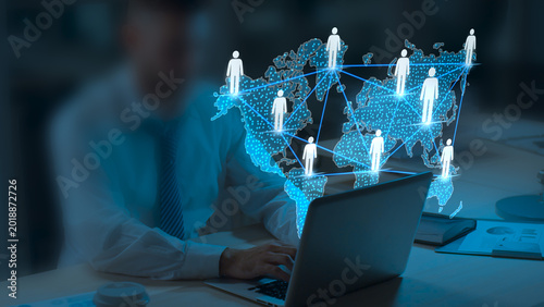 Businessman Using Laptop with Global Network Connection Map, Digital Communication Technology, Worldwide Social Media Networking, Remote Team Collaboration, Data Exchange and Global Business 
