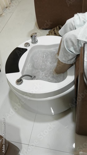 man washing hands in bathroom