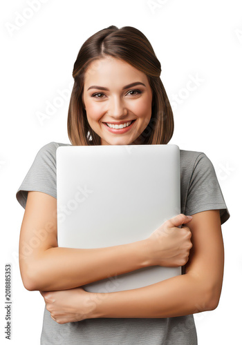 Happy young woman holding a closed laptop computer against her chest isolated on transparent background