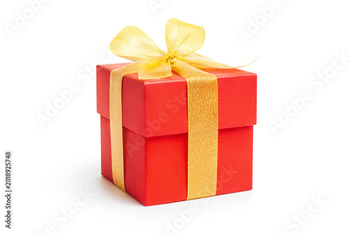 Red gift box with golden ribbon bow, isolated on white background. Perfect for holiday, birthday, or celebration themes. Ideal for advertising, greeting cards, or social media content